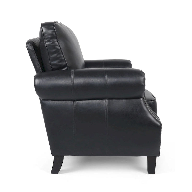 Fauteuil club en similicuir, orné de rivets