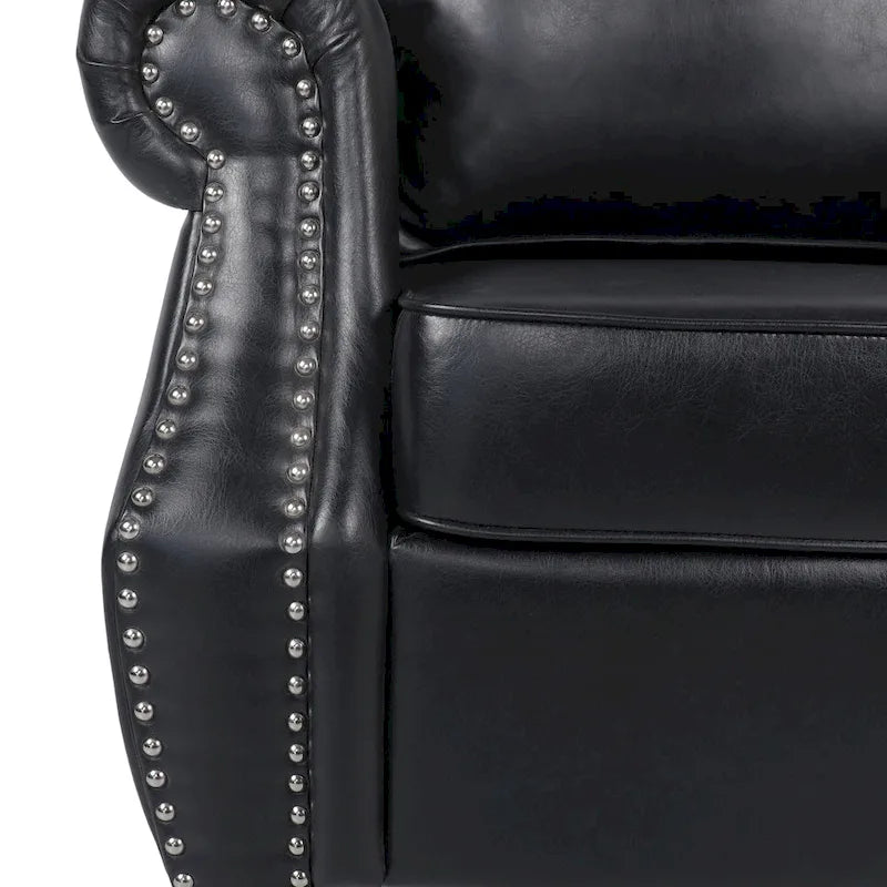 Fauteuil club en similicuir, orné de rivets