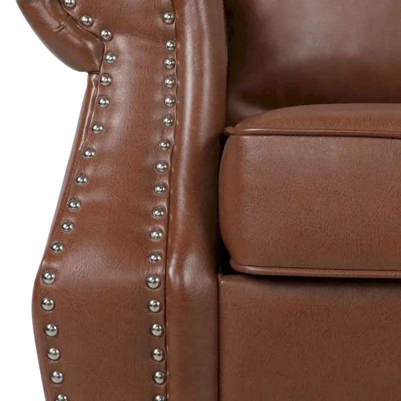 Fauteuil club en similicuir, orné de rivets